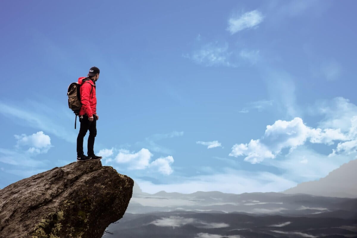 risk man on cliff