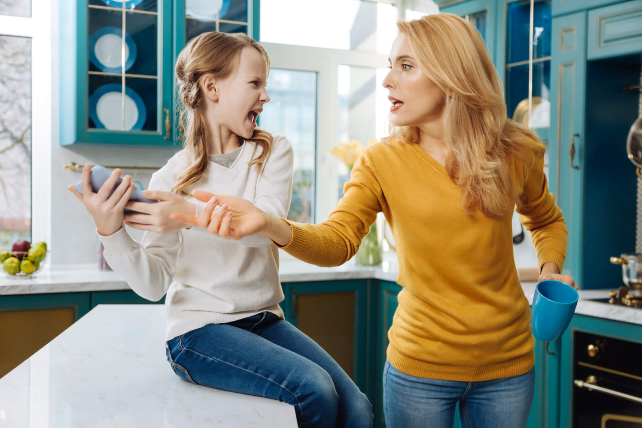 Angry girl upset mom tries taking phone away