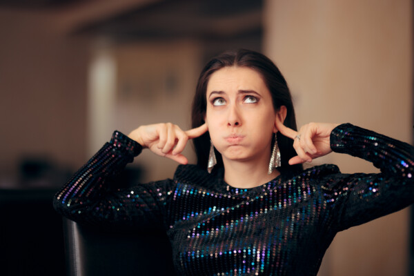 Party pooper: Unhappy woman alone at party