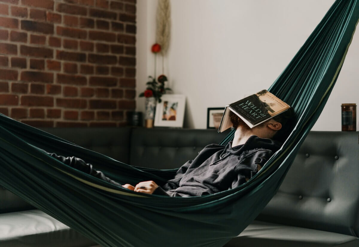 Man taking a nap in a hammock during his free time
