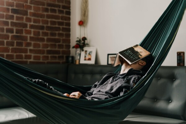Man taking a nap in a hammock during his free time