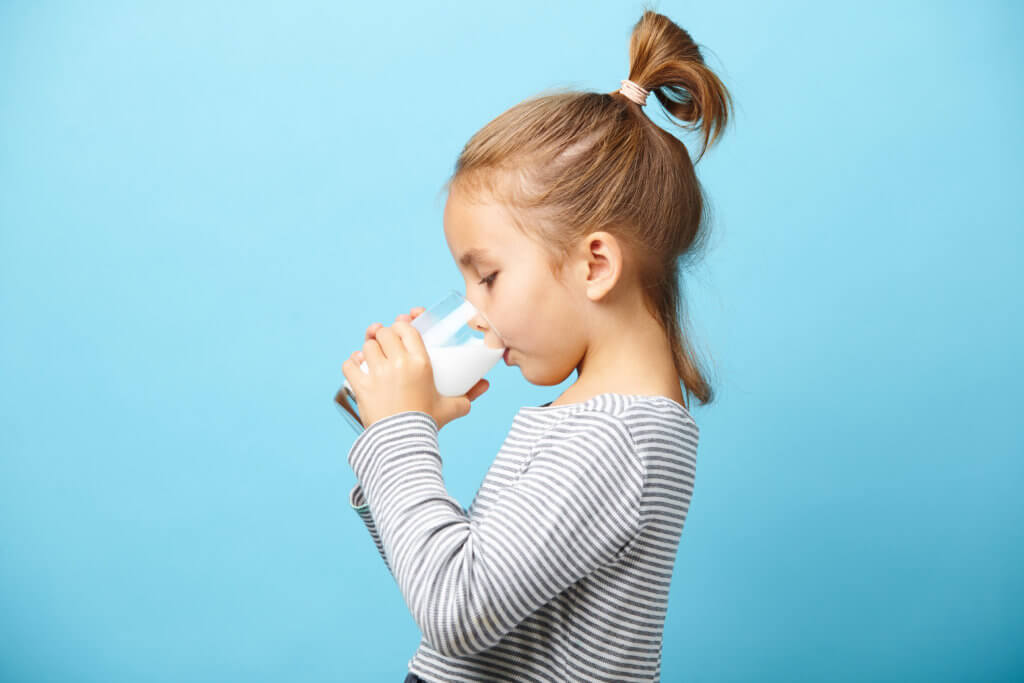 Little girl drinking milk