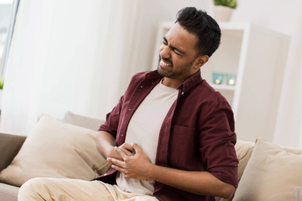 Man with stomach or gastrointestinal pain