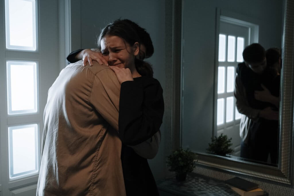 sad couple hugging