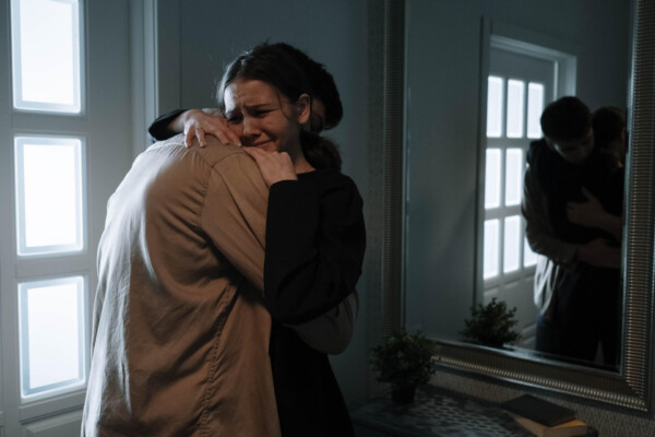 sad couple hugging