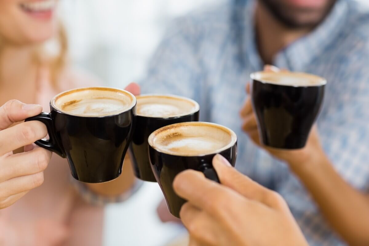 People drinking coffee, toasting