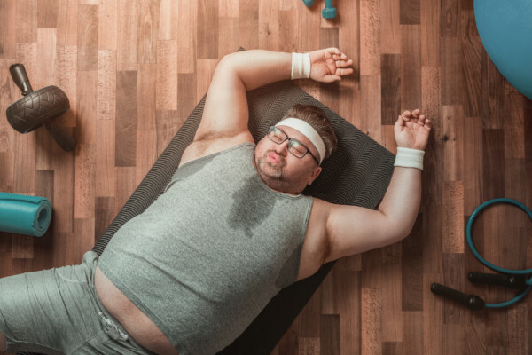 Man worn out, exhausted from exercising