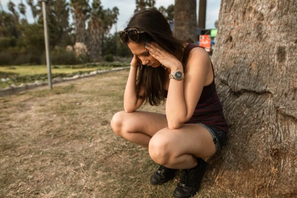 Anxious woman feeling stressed, headache