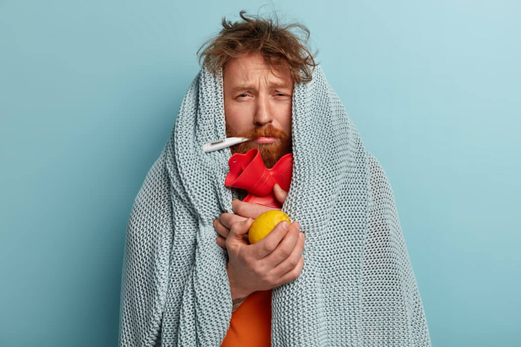 Man flu: Feeling sick, taking temperature