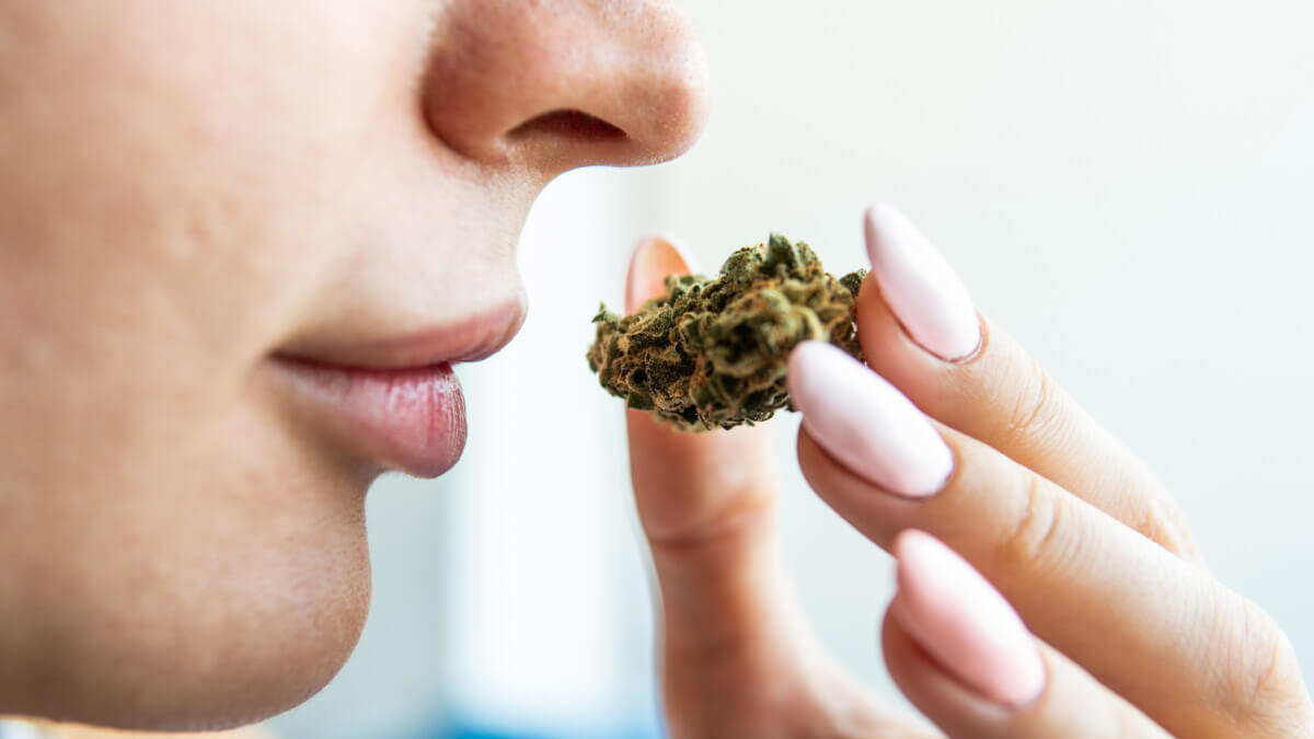 Woman smelling marijuana