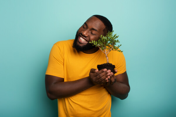 Man hugging his plant