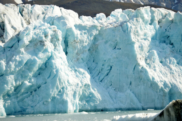 Tidewater ice glaciers receding and melting in the ocean