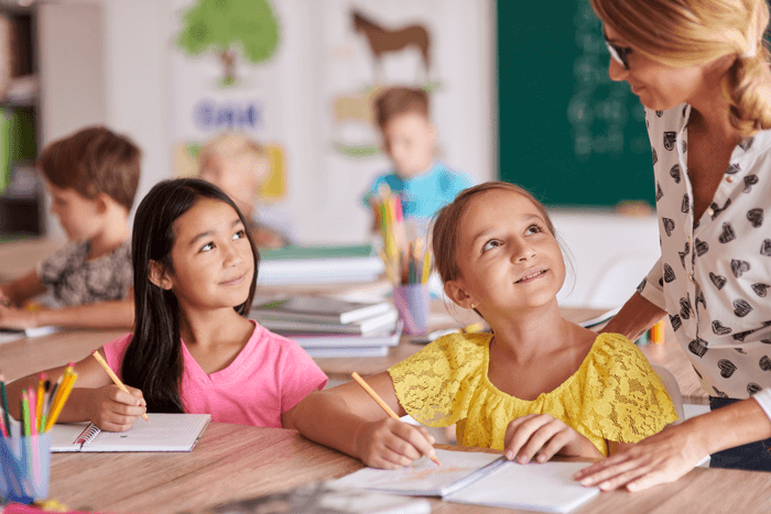 Children with teacher in classroom