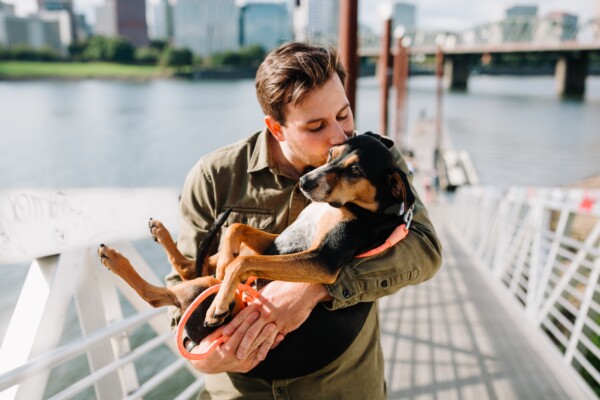 Man kissing his dog