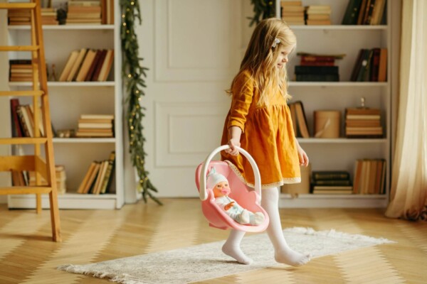 child plays with doll