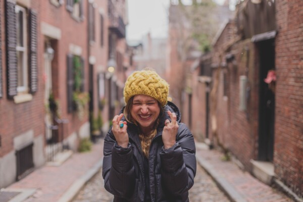 Woman crossing fingers for hope, optimism