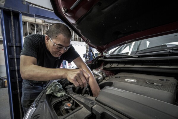 Mechanic fixing car
