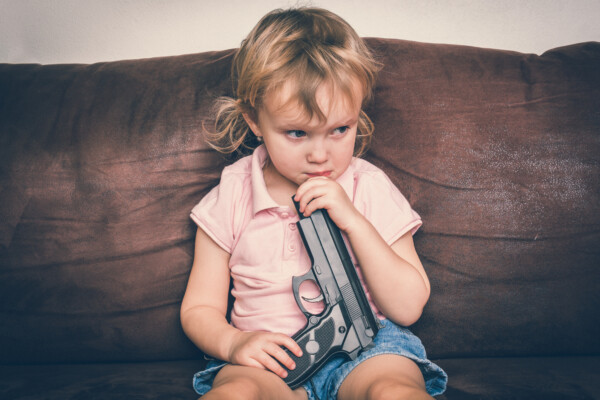 Child playing with gun