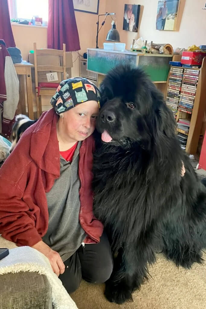 Lucy Giles at home with her rescue dog, Brody.