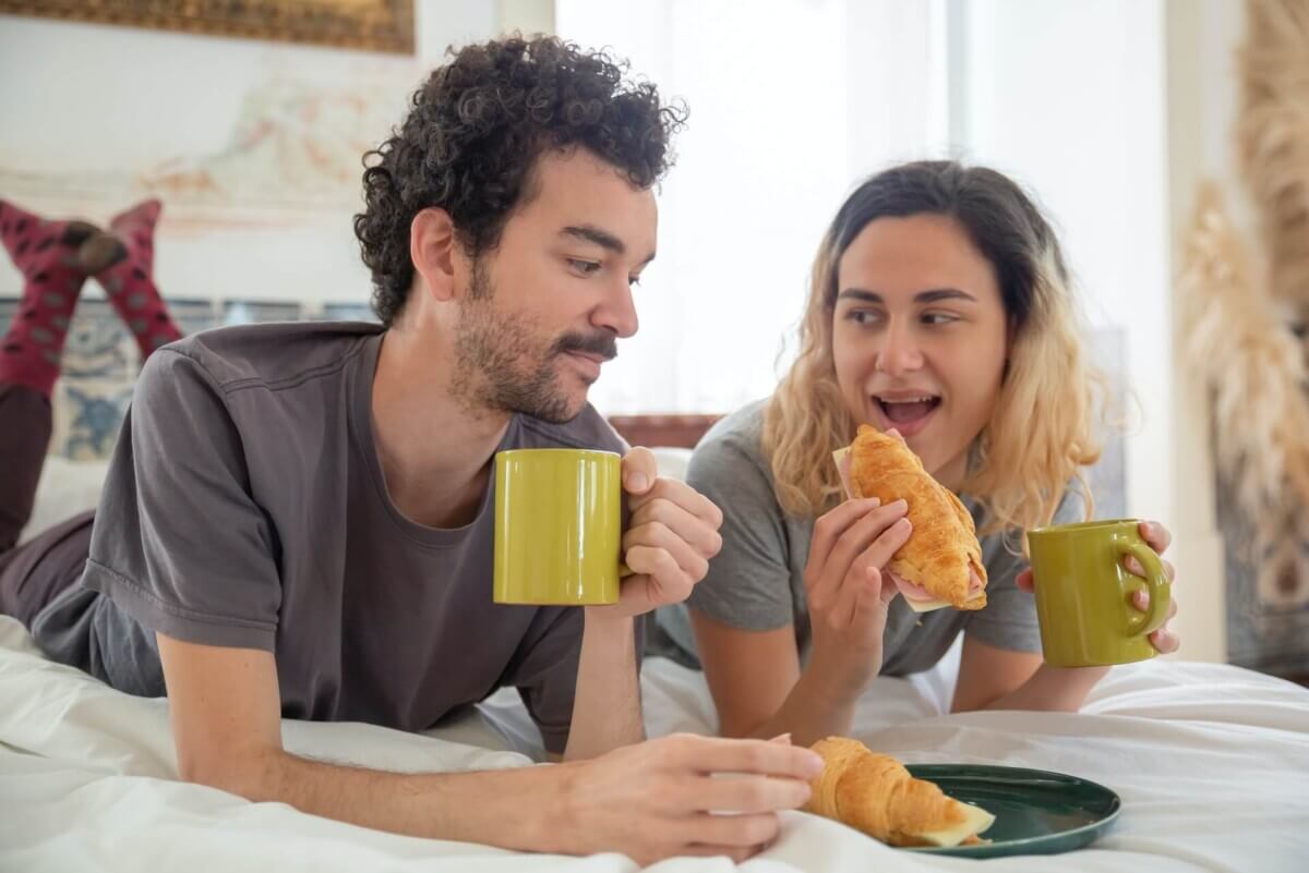 couple eating in bed