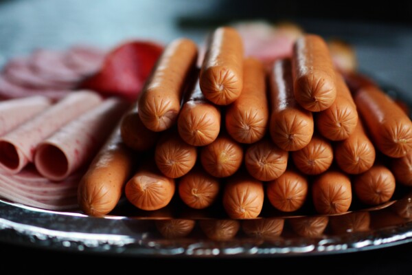 Hot dogs, processed meats on tray