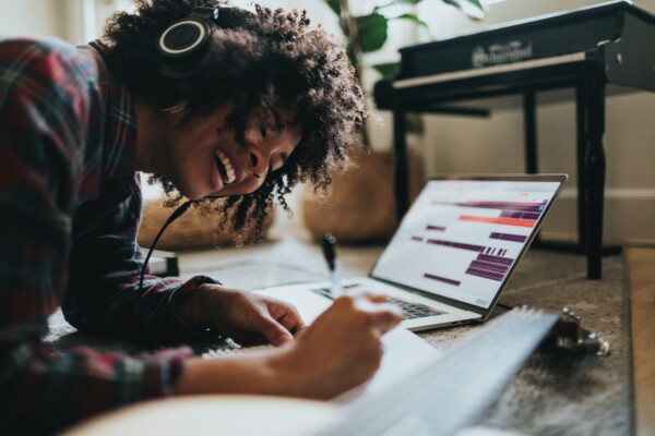 Woman listening to music while studying or working