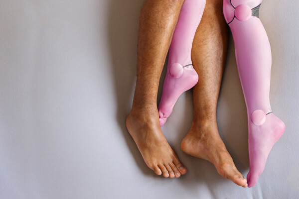 Sex robot in bed with man