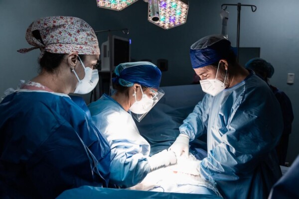 Surgeons performing surgery in the operating room