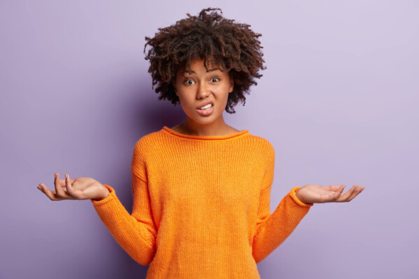Confused woman unsure of what to do.