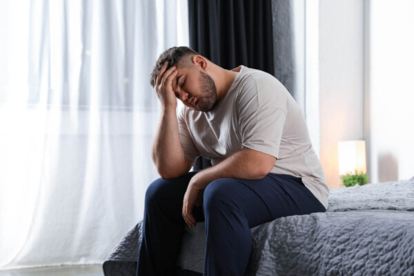 Overweight or obese man upset, sad, depressed
