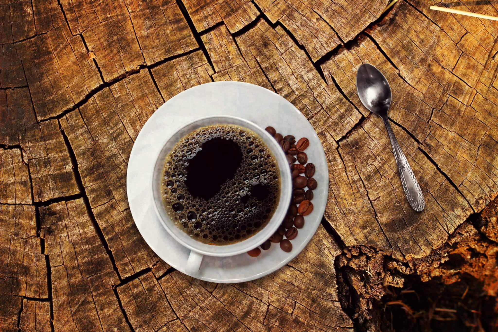 Cup of coffee with beans