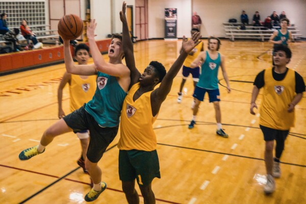 Teens playing basketball