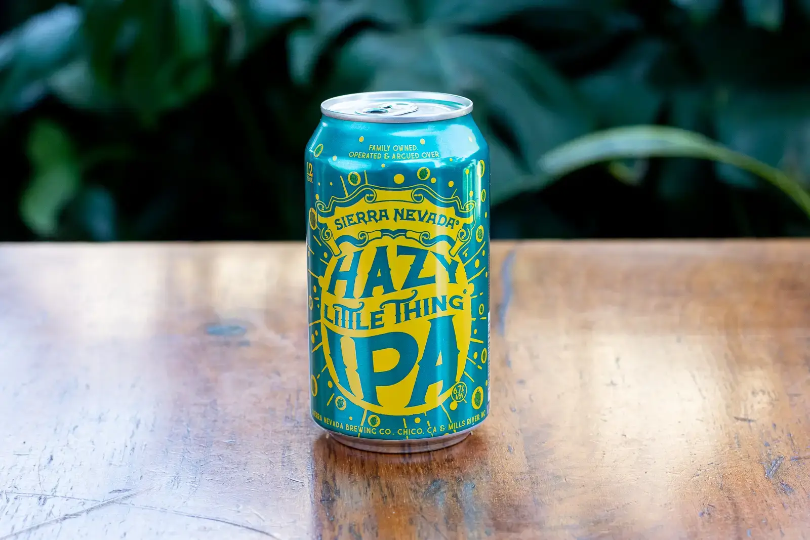 yellow and blue beer can sitting on a table 