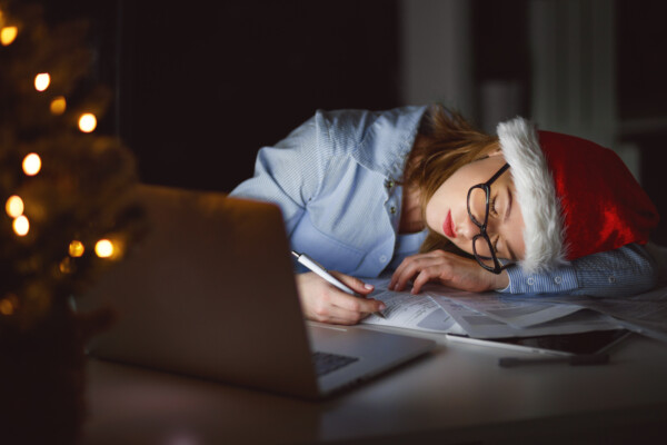 Woman tired from working late at night during holidays