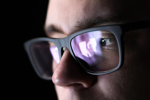Creepy man or stalker looking at woman's photo or video online