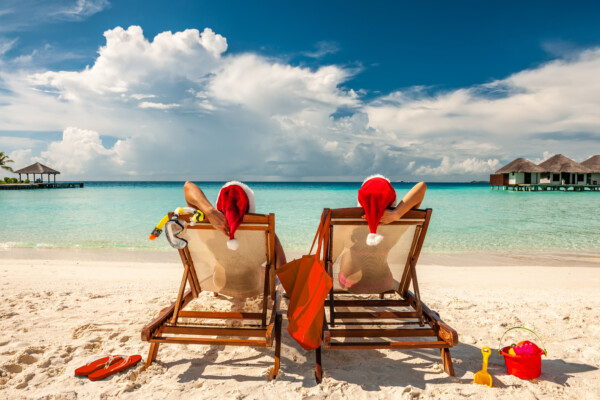 Couple having Christmas vacation at the beach