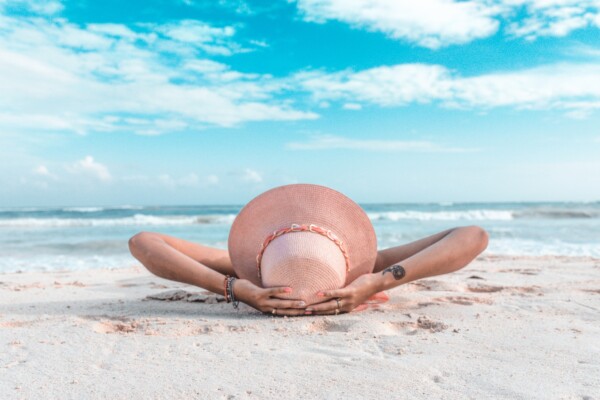 Woman relaxing on the beach during vacation