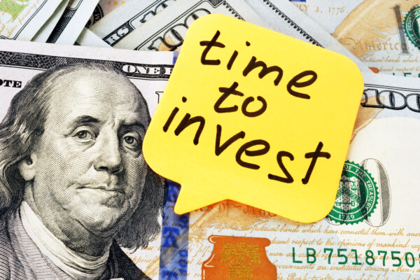 Picture of $100 bill with Ben Franklin saying, "Time To Invest"