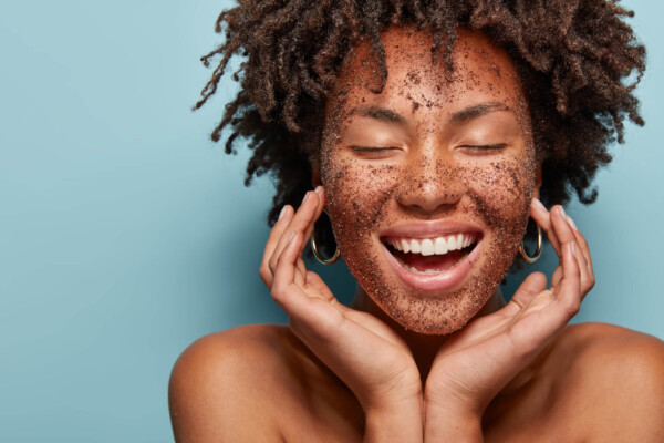 Woman exfoliating her face for best skin care