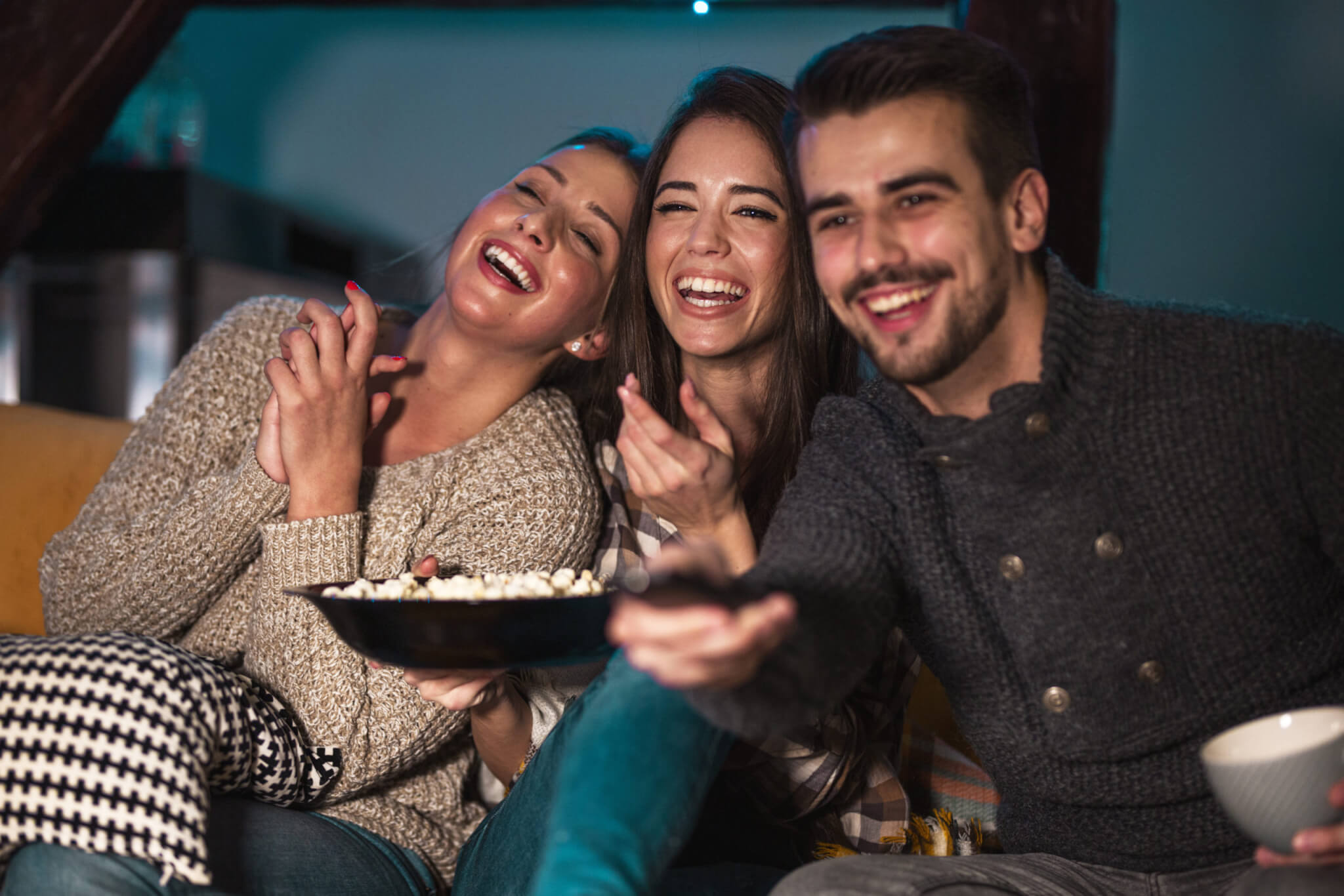 Friends or family watching comedy movie.