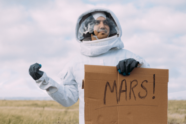 Astronaut hitchhiking to Mars