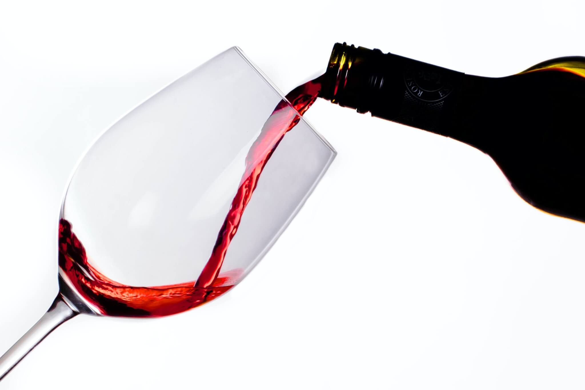 Red wine being poured into a glass