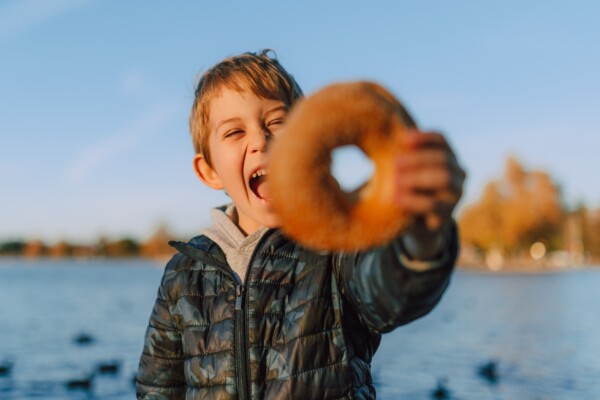 Boy holding a donut