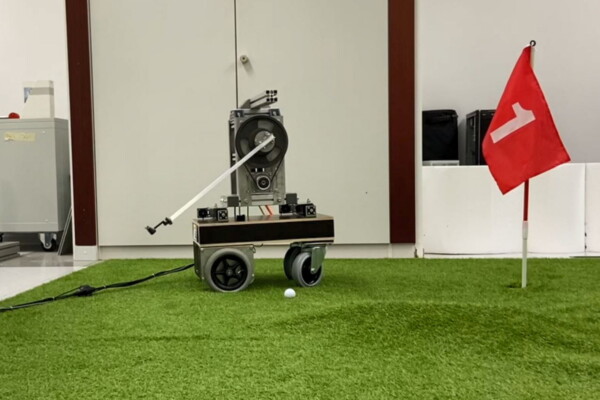 Golfi the robot making a putt.
