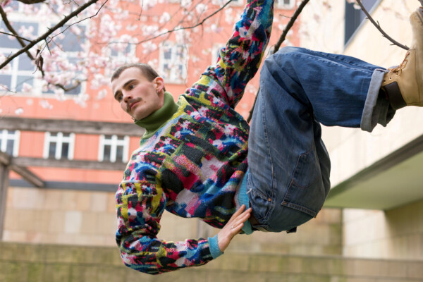 Man modeling the new Cap_able Manifesto Collection clothing line.