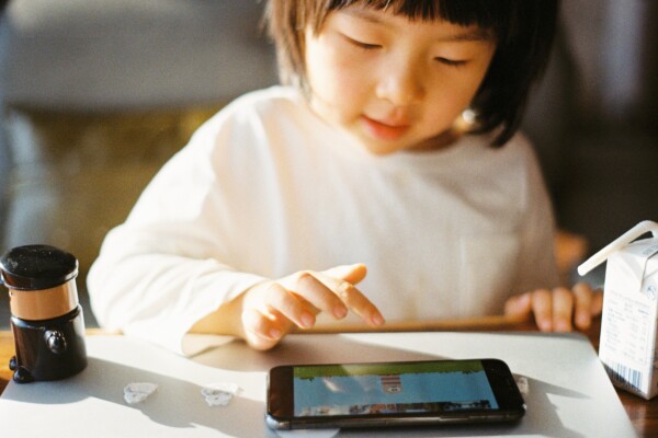 Little girl using a tablet for kids
