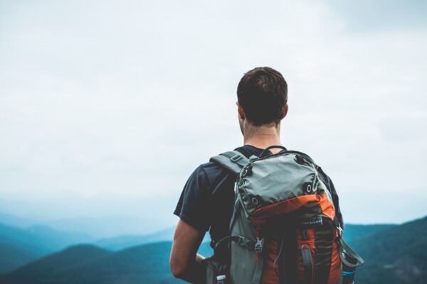 Man wearing a travel backpack