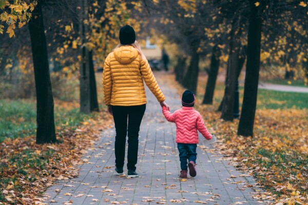Mother with young child taking a walk