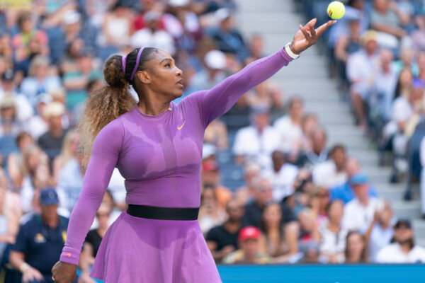 Women's tennis legend Serena Williams serves a ball at the 2019 U.S. Open