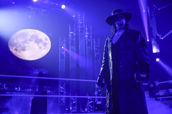 Hall of Famer The Undertaker stands in a WWE ring.